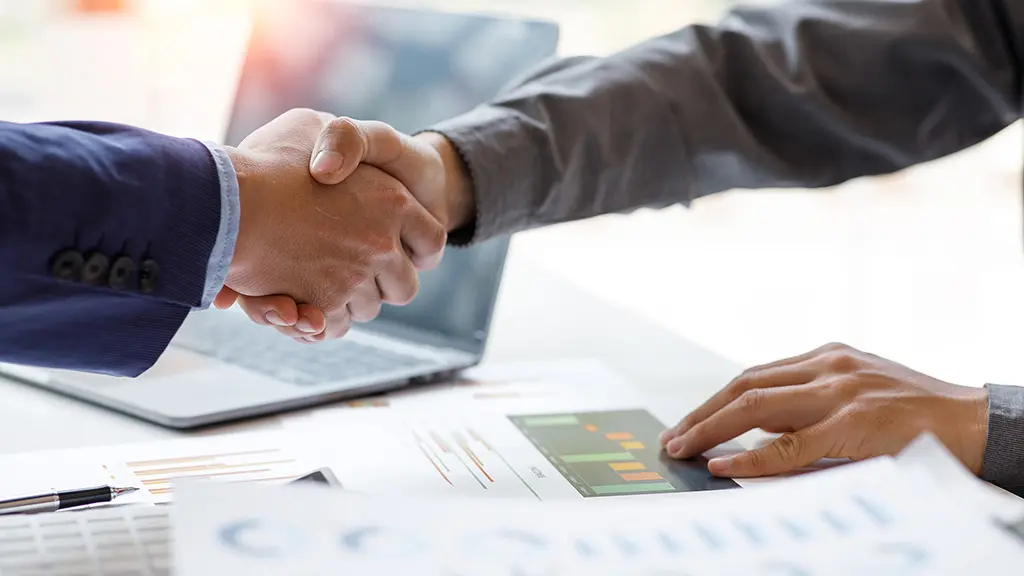 Decimo Srl Strategic Partnership. Handshake symbolizing a partnership for Decimo Srl.