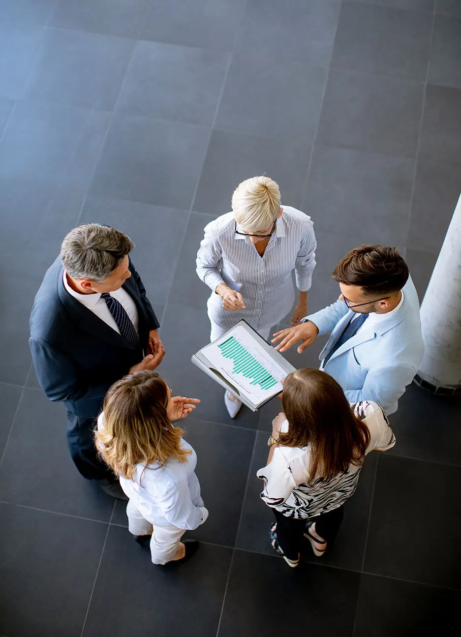 Decimo Team at Work: Design and Collaboration. Aerial view of the Decimo team during a work meeting.