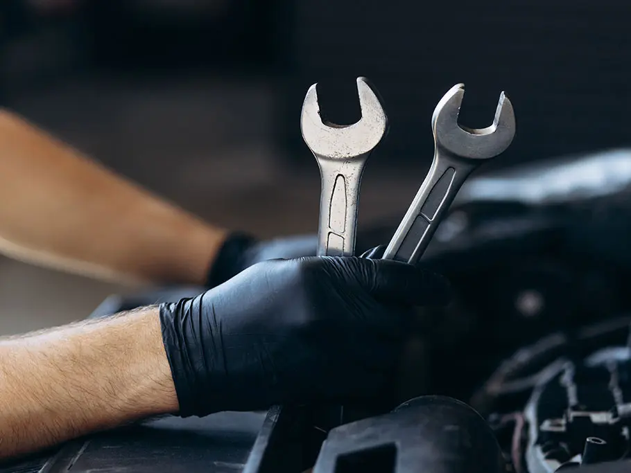 Join Our Mechanics Team Today Hands with Mechanic Tools: Start Your Career Here