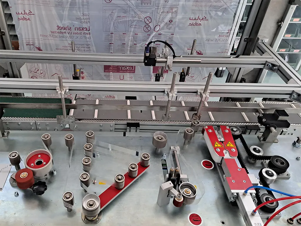 Head of the prototype Electronic Handle Applicator for applying adhesive handles on cardboard boxes